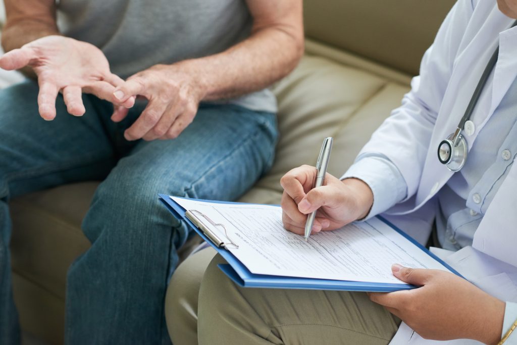 Crop doctor writing patient complaints