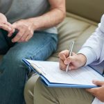 Crop doctor writing patient complaints