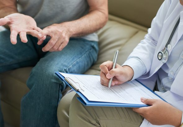 Crop doctor writing patient complaints