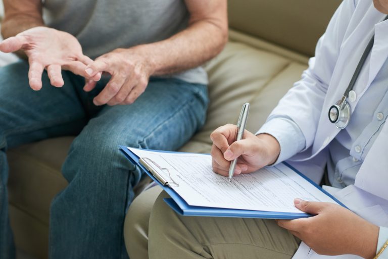 Crop doctor writing patient complaints